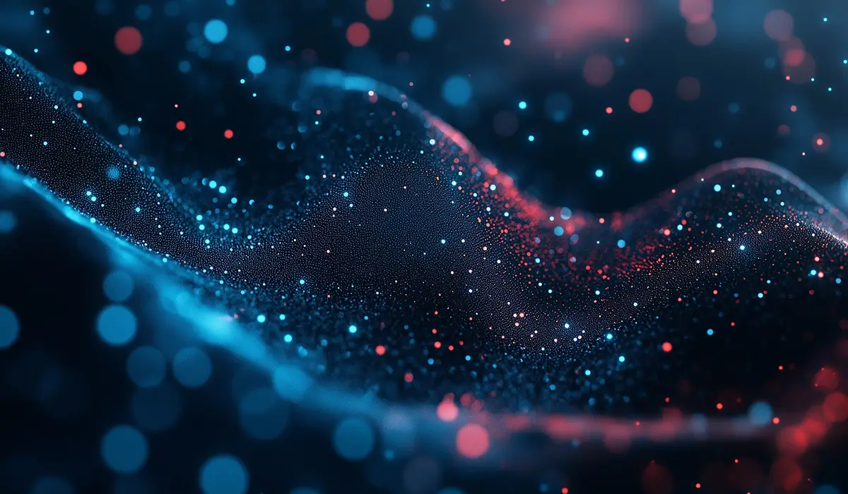Glowing particles in blue and red on a dark background.